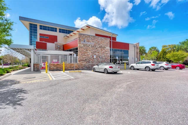 view of property with uncovered parking