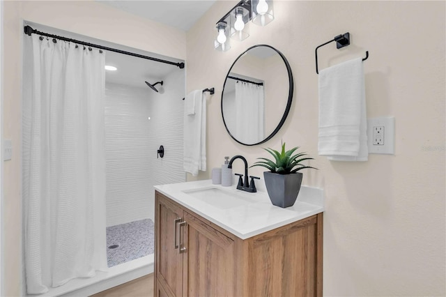 full bath featuring vanity and a shower with shower curtain