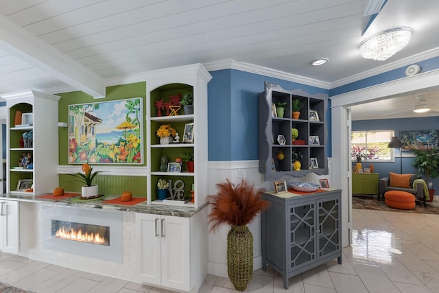 bar featuring wooden ceiling, a wainscoted wall, crown molding, and beam ceiling