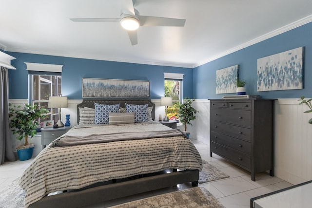 bedroom featuring marble finish floor, a ceiling fan, and crown molding