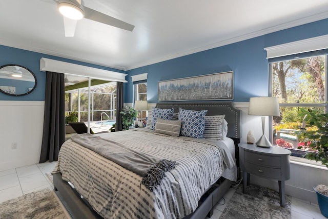 bedroom with marble finish floor, a wainscoted wall, crown molding, and ceiling fan