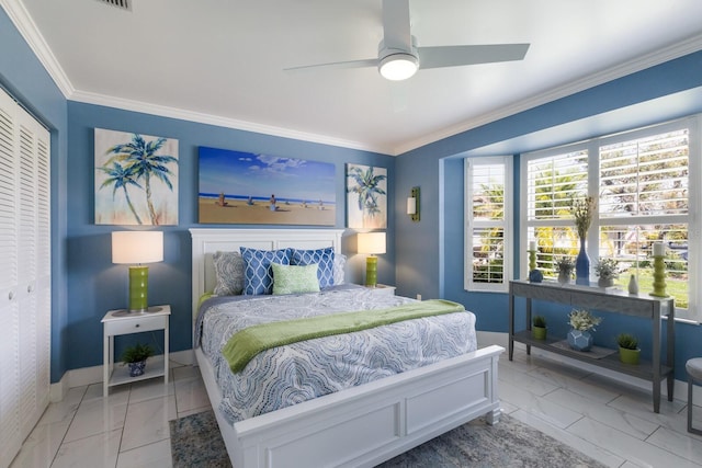 bedroom with baseboards, a ceiling fan, marble finish floor, crown molding, and a closet