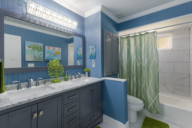 full bath featuring shower / bath combination with curtain, ornamental molding, a sink, and toilet