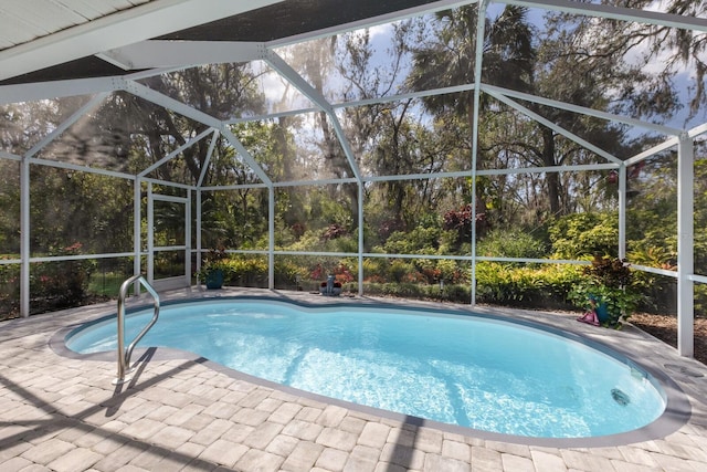 pool with a lanai and a patio