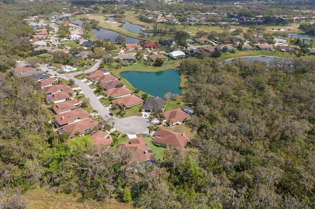 birds eye view of property featuring a residential view and a water view