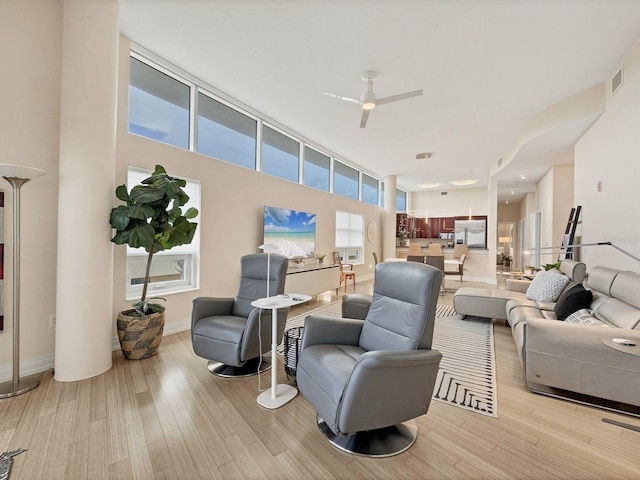 6512 Midnight Pass Rd Unit 504, Sarasota, FL 34242 - living room featuring light wood finished floors and ceiling fan
