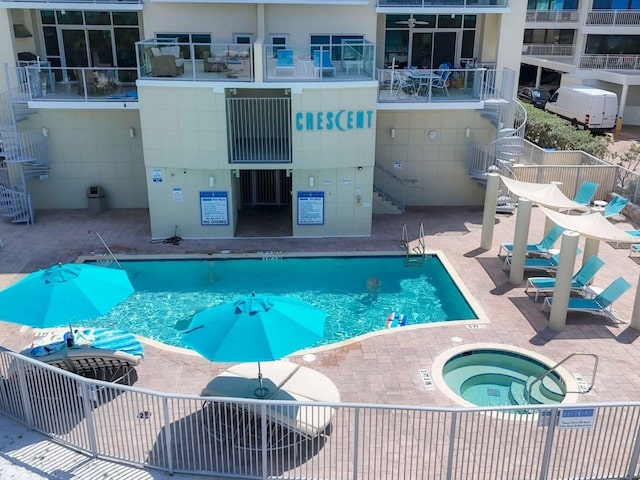 6512 Midnight Pass Rd Unit 504, Sarasota, FL 34242 - community pool with a hot tub, stairway, and a patio