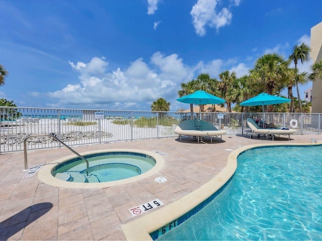 6512 Midnight Pass Rd Unit 504, Sarasota, FL 34242 - community pool featuring a patio area and a hot tub