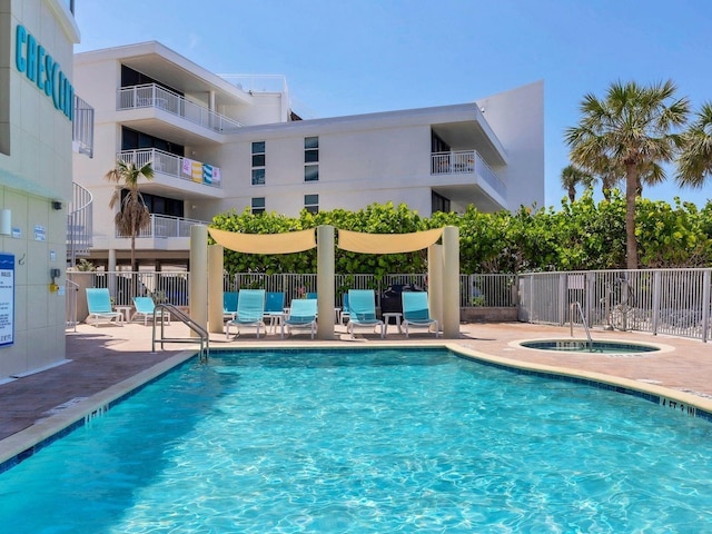 6512 Midnight Pass Rd Unit 504, Sarasota, FL 34242 - community pool featuring a hot tub and a patio