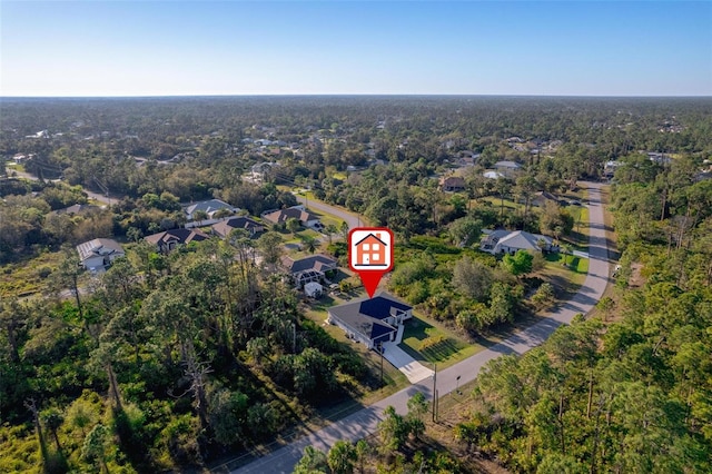 aerial view featuring a wooded view