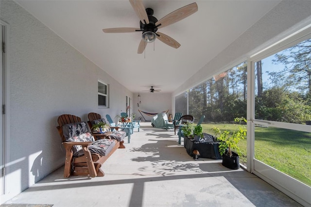 sunroom featuring a wealth of natural light and ceiling fan