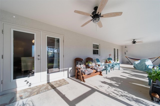 view of patio featuring a ceiling fan, french doors, and grilling area