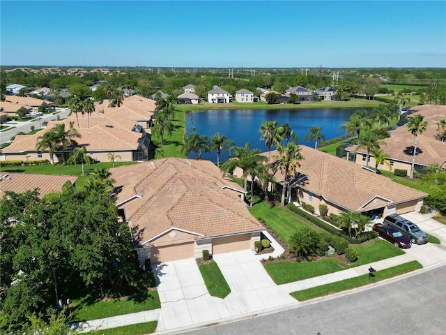 aerial view featuring a residential view and a water view