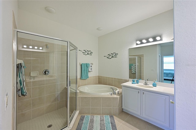 full bath with a garden tub, a shower stall, vanity, and tile patterned floors