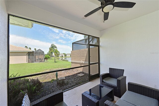 sunroom with a ceiling fan