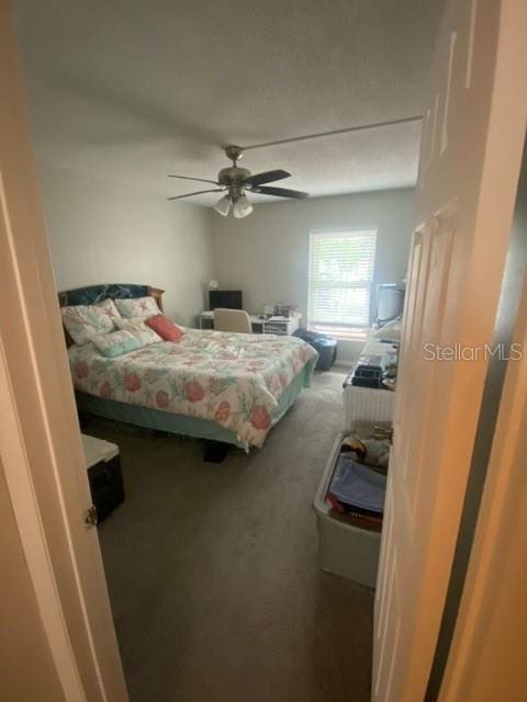 bedroom featuring carpet and a ceiling fan