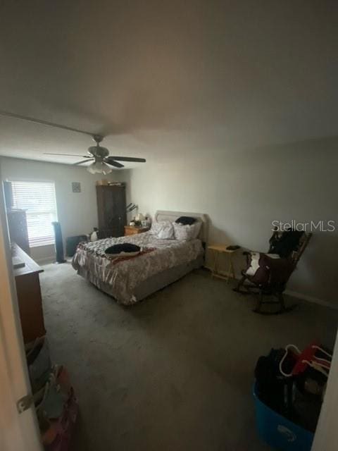 carpeted bedroom with a ceiling fan