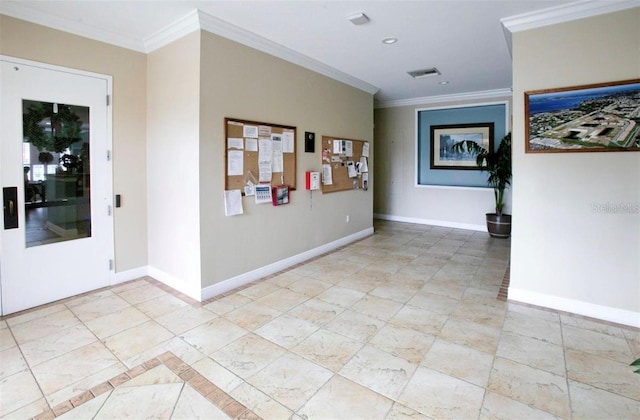 hallway with visible vents, baseboards, and crown molding