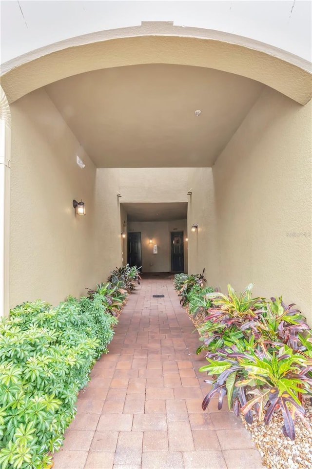 doorway to property with stucco siding