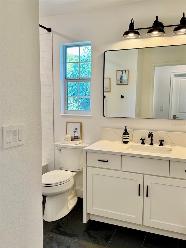 full bathroom featuring vanity and toilet