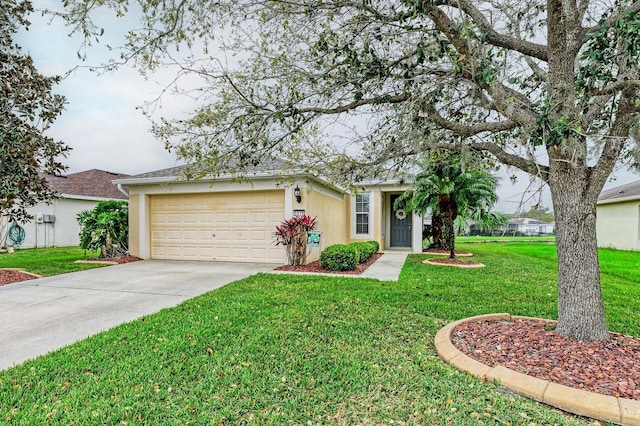 ranch-style house with a garage, concrete driveway, a front yard, and stucco siding