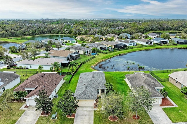 aerial view featuring a water view and a residential view