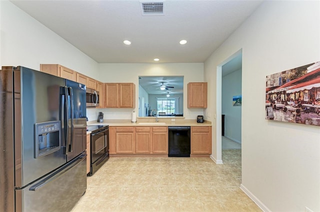 kitchen featuring recessed lighting, visible vents, baseboards, light countertops, and black appliances