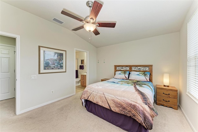 bedroom with light carpet, visible vents, baseboards, and lofted ceiling