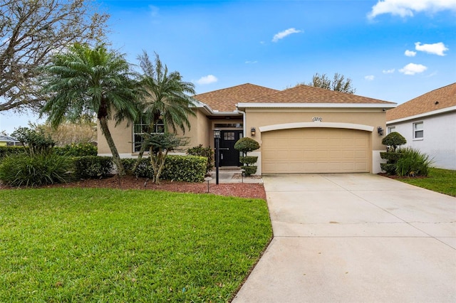 view of front of property featuring an attached garage, driveway, roof with shingles, stucco siding, and a front yard