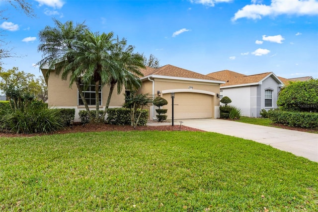 view of front of property with a garage, driveway, a front yard, and stucco siding