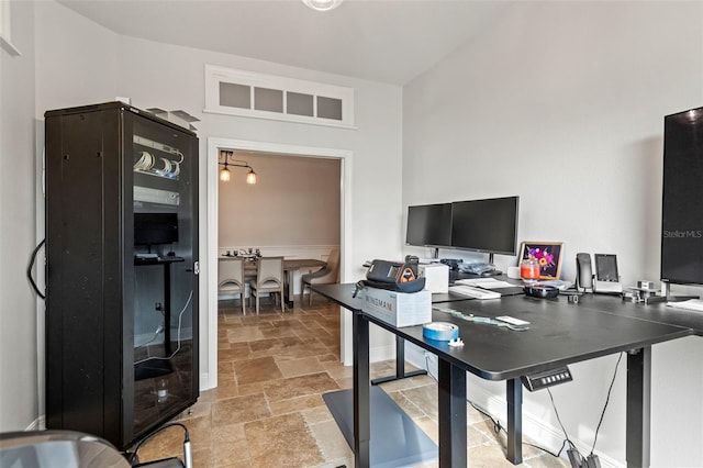 office area with stone tile flooring