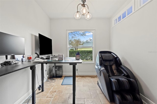 office with stone tile floors, baseboards, and a notable chandelier