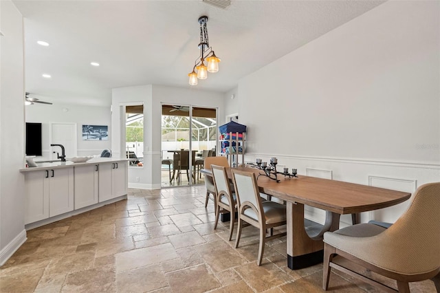 dining room with baseboards, recessed lighting, a ceiling fan, and stone tile floors