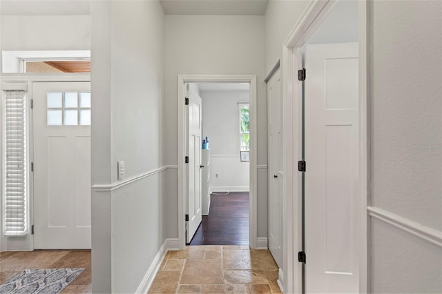 corridor with stone tile flooring