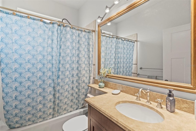 bathroom featuring toilet, shower / tub combo, and vanity