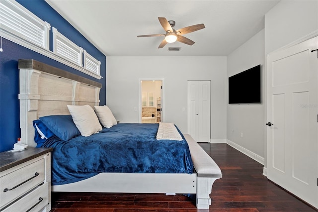 bedroom with baseboards, visible vents, dark wood finished floors, a ceiling fan, and ensuite bath