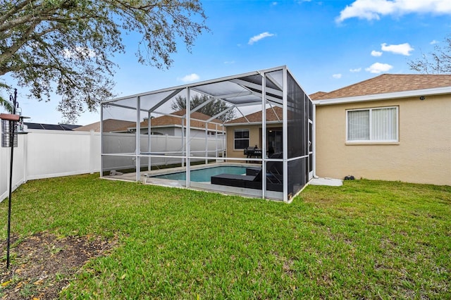 exterior space with a fenced in pool, a fenced backyard, a lawn, and stucco siding