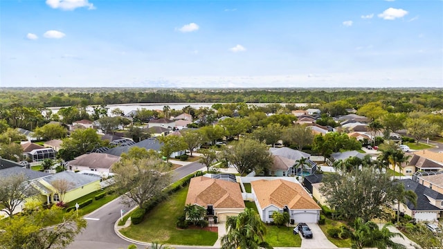 birds eye view of property featuring a water view and a residential view