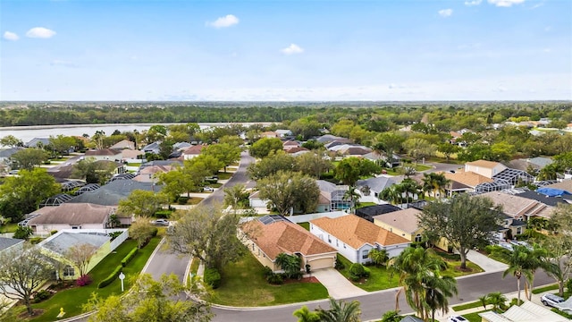 bird's eye view featuring a water view and a residential view