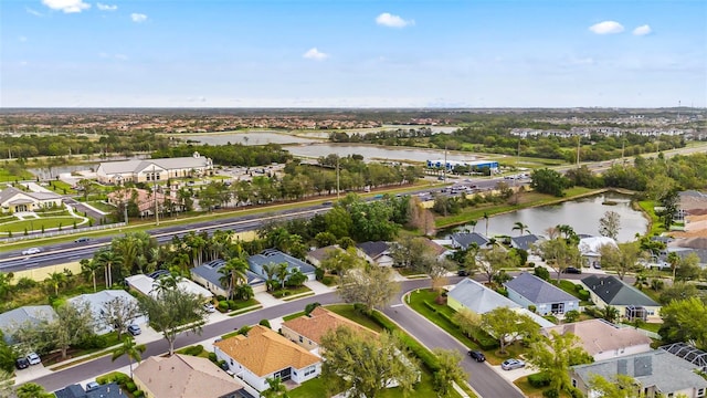 aerial view featuring a residential view and a water view