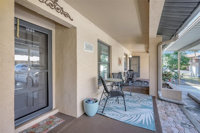 view of patio featuring a porch