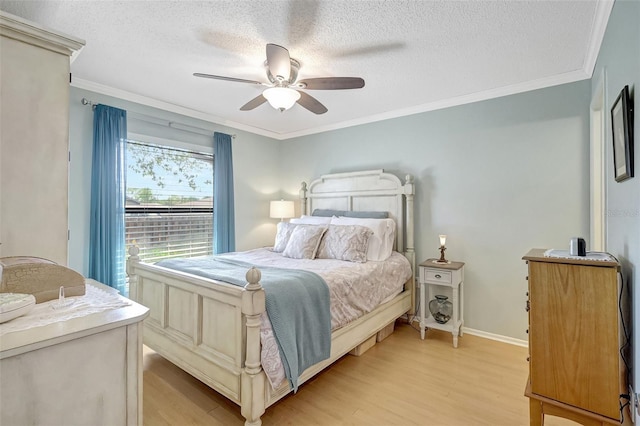 bedroom featuring a textured ceiling, baseboards, light wood-style flooring, and crown molding