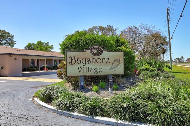 community / neighborhood sign with driveway