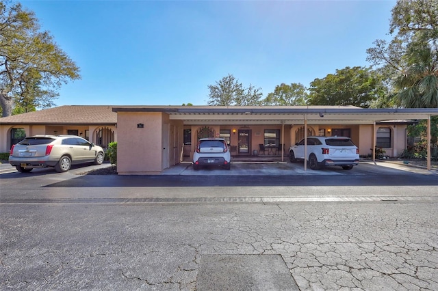 2808 60th Ave W Unit 1603, Bradenton, FL 34207 - view of building exterior featuring covered parking