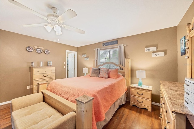 bedroom featuring dark wood-style flooring, ceiling fan, and baseboards