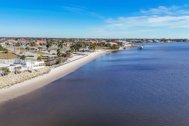 aerial view featuring a water view and a beach view