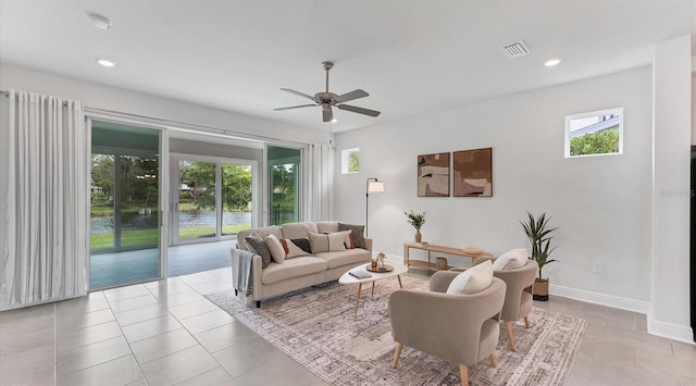 tiled living room with recessed lighting, visible vents, baseboards, and a ceiling fan