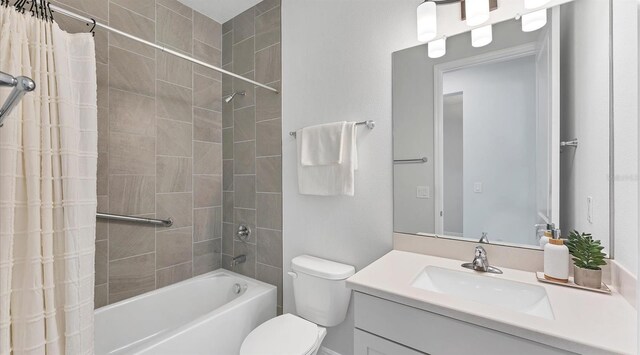 full bathroom with vanity, shower / bath combination with curtain, and toilet