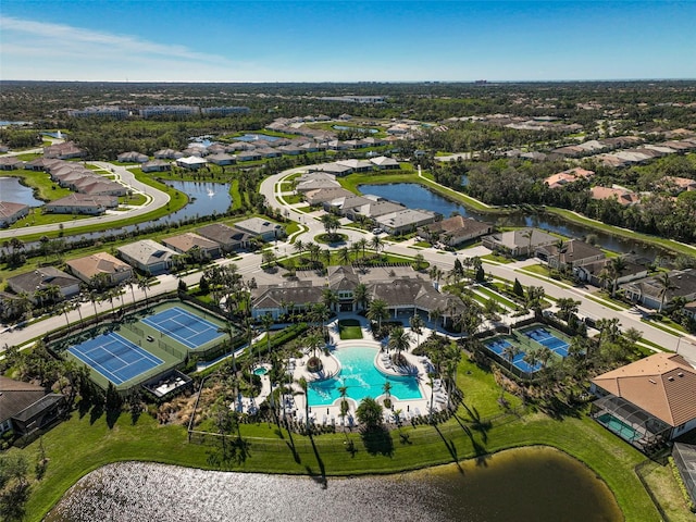 bird's eye view with a residential view and a water view