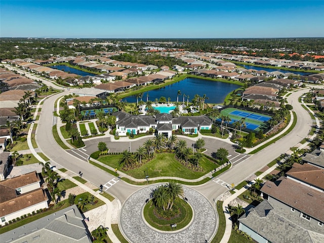 drone / aerial view with a residential view and a water view